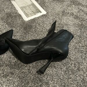 Black leather condition is very good wore 4times at most square heel,